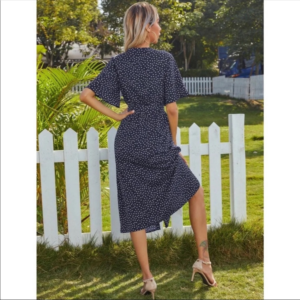 Medium Polka Dot dress with Peek-A-Boo front twist. Fits average height & weight
